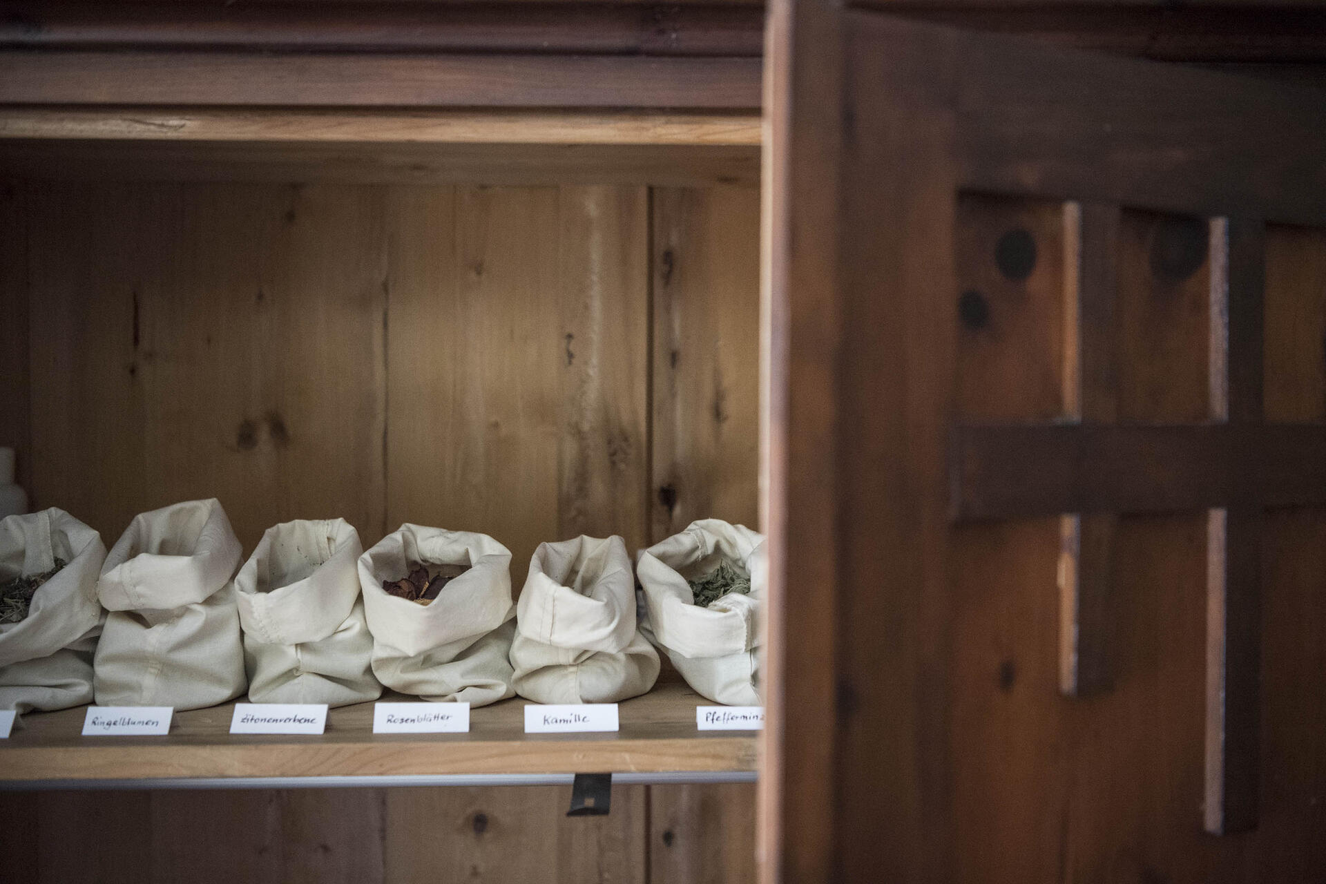 Cupboard with various herbs